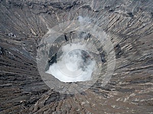 Beautiful active Volcano with smoke Mount Bromo with lot of tourist