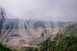 Beautiful active Volcano with smoke Mount Bromo with lot of tourist