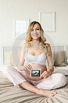 Beautiful adult pregnant woman. Waiting for the baby. Pregnancy. Care, tenderness, motherhood, childbirth.