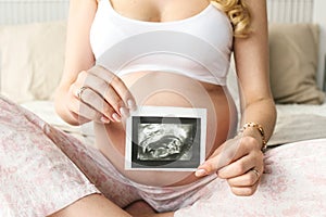 Beautiful adult pregnant woman. Waiting for the baby. Pregnancy. Care, tenderness, motherhood, childbirth.