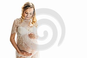 Beautiful adult pregnant woman. Waiting for the baby. Pregnancy. Care, tenderness, motherhood, childbirth. White