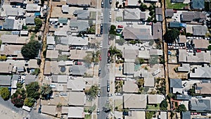 Beautiful aerial drone flyover shot of American suburb residential block district, peaceful neighborhood on a sunny day.