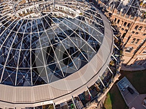 Beautiful aerial drone shot of Old Gasometer buidlings roof in Vienna from up above. Used like gasholders, it is music