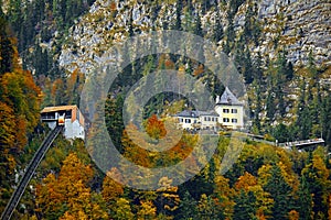 Beautiful aerial fall view of cable car ropeway funicular in austrian alps. Red cable railway car in the mountains