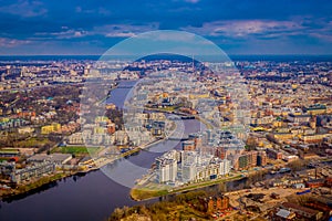 Beautiful aerial panoramic view of the Neva River with some buildings of the city from a height, in the summer, St