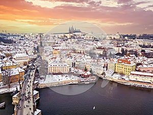 Beautiful aerial sunset view of the snow covered old town of Prague