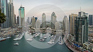 Beautiful aerial top view day to night timelapse of Dubai Marina in Dubai, UAE