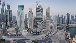 Beautiful aerial top view day to night transition timelapse of Dubai Marina canal