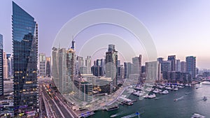 Beautiful aerial top view day to night transition timelapse of Dubai Marina canal