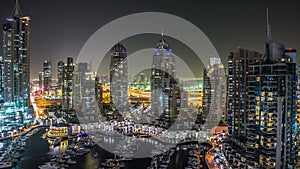 Beautiful aerial top view at night timelapse of Dubai Marina in Dubai, UAE