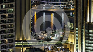 Beautiful aerial top view at night timelapse of Dubai Marina in Dubai, UAE