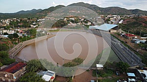 Beautiful aerial view of a brown lake and dense buildings in Nogales Sonora, Mexico
