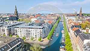 Beautiful aerial view of Copenhagen skyline from above, Nyhavn historical pier port and canal with color buildings and boats