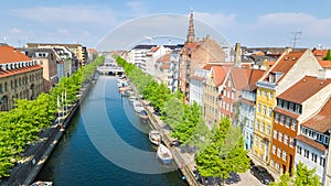 Beautiful aerial view of Copenhagen skyline from above, Nyhavn historical pier port and canal with color buildings and boats