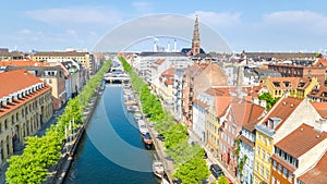 Beautiful aerial view of Copenhagen skyline from above, Nyhavn historical pier port and canal with color buildings and boats