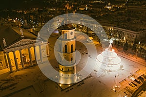 Beautiful aerial view of decorated and illuminated Christmas tree on the Cathedral Square at night in Vilnius. Celebrating