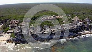 Beautiful aerial view of the eco wooden houses in the middle of a jungle