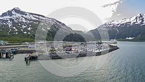 Beautiful aerial view of the harbor in Whittier, Alaska with a cruise ship coming in from afar