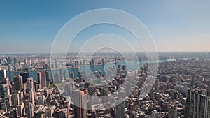 Beautiful aerial view of Hudson river in Manhattan in backdrop of skyscrapers of cityscape.