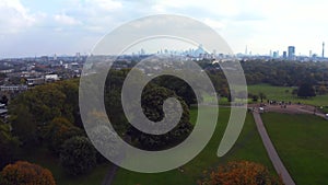 Beautiful aerial view of London with many green parks and city skyscrapers