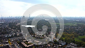 Beautiful aerial view of London with many green parks and city skyscrapers