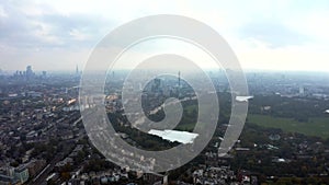 Beautiful aerial view of London with many green parks and city skyscrapers