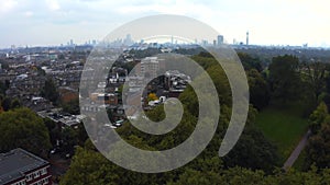 Beautiful aerial view of London with many green parks and city skyscrapers