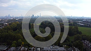 Beautiful aerial view of London with many green parks and city skyscrapers