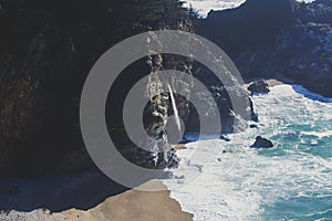 Beautiful aerial view of Mcway Falls with Julia Pfeiffer Beach and Pacific Ocean, Big Sur, Monterey County, California, United photo