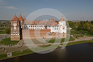 Beautiful aerial view of Medieval Mir castle complex on sunny sp