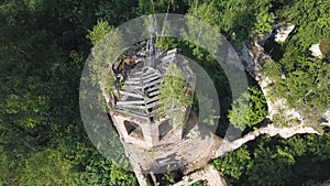 Beautiful aerial view of an Orthodox Church and surrounding forest. Clip. Top view of ruined and abandoned chapel