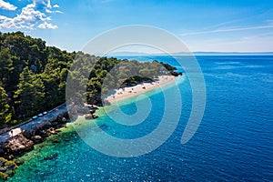Beautiful aerial view of Punta Rata beach in Brela, Makarska Riviera, Croatia. Aerial view of Punta Rata beach and waterfront on photo