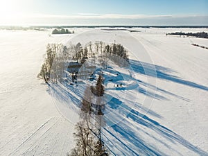 Beautiful aerial view of snow covered fields. Scenic winter landscape near Vilnius, Lithuania