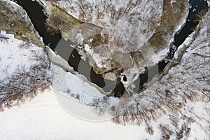 Beautiful aerial view of snow covered pine forests. Rime ice and hoar frost covering trees. Scenic landscape near Vilnius,