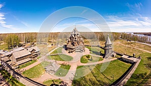 Beautiful Aerial view to traditional Russian village with orthodox wooden chapel and bell tower in Bogoslovka manor