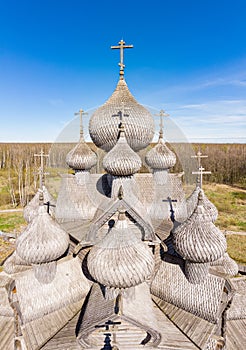 Beautiful Aerial view to traditional Russian village with orthodox wooden chapel and bell tower in Bogoslovka manor