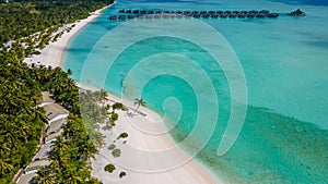 Beautiful aerial view of the tropical island with beach and palm trees near ocean