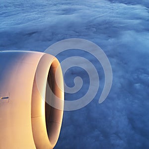 Beautiful aerial view through window of commercial airplane, part of the airplane wind and gas turbine engine