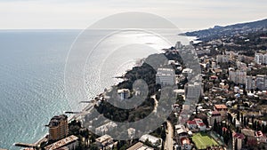 Beautiful aerial view of the Yalta bay in Crimea. Aerial view of Yalta embankment from drone, old Lighthouse on pier, sea coast la