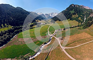 Beautiful aerial wide view. Summer sunny day, Wasserfall Erlebnisweg river lake and buildings. the consequence of severe floods,