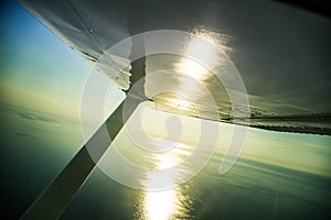 A beautiful aero landscape of a Baltic sea looking out of a small plane window under the wing. Riga, Latvia, Europe in summer. Aut