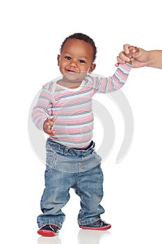 Beautiful African American baby learning to walk