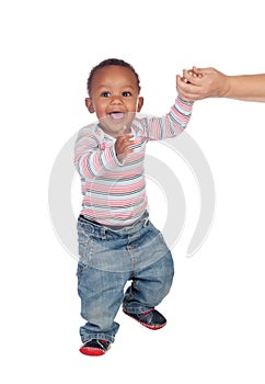 Beautiful African American baby learning to walk