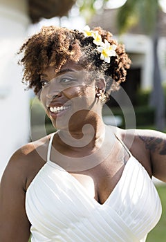 Beautiful African American bride with floral hairstyle