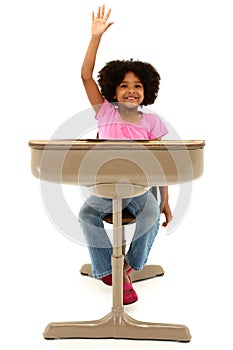 Beautiful African American Child Sitting In A Desk