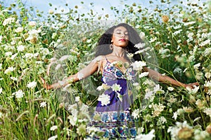 Beautiful African American girl enjoys summer day.