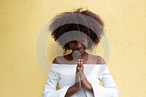 A beautiful African American prays