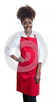 Beautiful african american waitress with curly hair and red apron