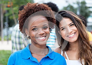 Beautiful african american woman with caucasian girl