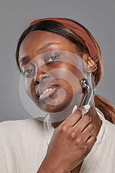 Beautiful African American Woman Enjoying Face Massage